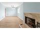 Large living room with light colored walls, wood floor, fireplace and large windows at 2961 Valencia Rd, Venice, FL 34293
