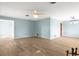 Large living room with wood floors and light blue walls at 2961 Valencia Rd, Venice, FL 34293