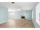 Bright living room with a cozy fireplace and shuttered windows at 2961 Valencia Rd, Venice, FL 34293