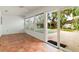 Bright sunroom with tile floors and a view of the pool at 2961 Valencia Rd, Venice, FL 34293
