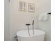 Relaxing bathroom features a soaking tub, unique tile, and modern fixtures at 305 73Rd St, Holmes Beach, FL 34217