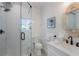 Modern bathroom with a glass-enclosed shower and stylish white vanity at 305 73Rd St, Holmes Beach, FL 34217