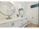 Modern bathroom with dual vanities, matte black fixtures, and wood-look tile flooring at 305 73Rd St, Holmes Beach, FL 34217