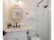 Modern bathroom with a glass-enclosed shower, stylish vanity, and neutral decor at 305 73Rd St, Holmes Beach, FL 34217