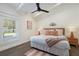 Cozy bedroom featuring neutral tones, wood accents, and ample natural light at 305 73Rd St, Holmes Beach, FL 34217