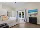 Bright bedroom features a sliding glass door and a view of the patio at 305 73Rd St, Holmes Beach, FL 34217