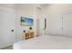 Well-lit bedroom with white walls, wood accents, and a television at 305 73Rd St, Holmes Beach, FL 34217