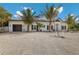 Beautiful single-Gathering home featuring a white exterior with black shutters and professional landscaping at 305 73Rd St, Holmes Beach, FL 34217