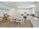 The kitchen features modern appliances, white cabinets, and a casual dining area at 305 73Rd St, Holmes Beach, FL 34217
