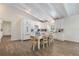 Open concept kitchen boasts white cabinets, stainless appliances, and casual dining at 305 73Rd St, Holmes Beach, FL 34217
