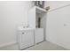 Bright laundry area includes a Whirlpool washer and dryer set and epoxy floor at 305 73Rd St, Holmes Beach, FL 34217