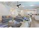 Open concept floorplan with beamed ceilings connecting the living room, kitchen, and dining areas at 305 73Rd St, Holmes Beach, FL 34217
