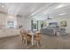 Spacious living area featuring wood floors, modern kitchen, and comfortable dining area at 305 73Rd St, Holmes Beach, FL 34217