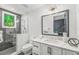Modern bathroom featuring a white vanity, walk-in shower, and updated finishes at 315 N Bay Blvd, Anna Maria, FL 34216