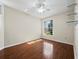 This room has gleaming hardwood floors, a window with sunbeams, and built in shelves at 3835 Alamanda Dr, Sarasota, FL 34238