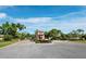 A picturesque entrance to the Mira Lago community with a gatehouse, landscaping and signage at 3835 Alamanda Dr, Sarasota, FL 34238