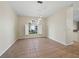 Bright dining room features tile flooring, neutral walls, and an arched window with natural light at 3835 Alamanda Dr, Sarasota, FL 34238