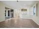 Open-concept living space with tile floors, seamless transitions to the lanai and kitchen, and abundant natural light at 3835 Alamanda Dr, Sarasota, FL 34238