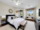 Bright and spacious bedroom with a large bed, ceiling fan, and sliding door access to the lanai at 3835 Alamanda Dr, Sarasota, FL 34238