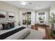 Serene main bedroom with access to the lanai, complemented by natural light and calming decor at 3835 Alamanda Dr, Sarasota, FL 34238