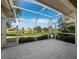 Screened patio with lake views, providing a relaxing outdoor living space at 3835 Alamanda Dr, Sarasota, FL 34238