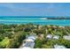 Breathtaking aerial view showcases coastal real estate with expansive ocean views at 4050 Higel Ave, Sarasota, FL 34242