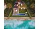 Stunning beachfront property with a private pool, outdoor dining area, and direct access to the beach at 4050 Higel Ave, Sarasota, FL 34242