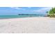 Beautiful beach with white sand and clear ocean water, perfect for relaxation at 4050 Higel Ave, Sarasota, FL 34242