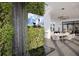 Open living and dining space featuring a unique waterfall wall and modern decor at 4050 Higel Ave, Sarasota, FL 34242