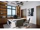 Contemporary office with built-in shelving, ocean views, and stylish furnishings creates an inspiring workspace at 4050 Higel Ave, Sarasota, FL 34242