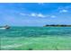 Expansive turquoise ocean view with boats under a sunny blue sky at 4050 Higel Ave, Sarasota, FL 34242