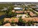 Wide aerial view featuring the community pool, landscaping, and nearby amenities at 4061 Crockers Lake Blvd # 2618, Sarasota, FL 34238