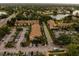 Aerial view of the community showing mature landscaping, parking, and multiple buildings at 4061 Crockers Lake Blvd # 2618, Sarasota, FL 34238
