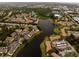 Aerial view showcasing community and lake views, highlighting green spaces at 4061 Crockers Lake Blvd # 2618, Sarasota, FL 34238