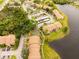 An appealing aerial view shows the residences and lake at 4061 Crockers Lake Blvd # 2618, Sarasota, FL 34238