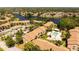 Overhead view showcases the community pool, landscaping, and proximity to a serene lake at 4061 Crockers Lake Blvd # 2618, Sarasota, FL 34238
