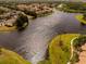 Expansive aerial shot showcasing the community's waterfront views and winding walking paths at 4061 Crockers Lake Blvd # 2618, Sarasota, FL 34238