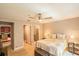 Comfortable bedroom features soft lighting and neutral tones, adjacent to bathroom and kitchen at 4061 Crockers Lake Blvd # 2618, Sarasota, FL 34238