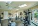 Community gym with various fitness machines including treadmills, ellipticals, and weight machines at 4061 Crockers Lake Blvd # 2618, Sarasota, FL 34238