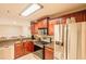 This modern kitchen features stainless steel appliances and granite countertops, with a cozy breakfast bar at 4061 Crockers Lake Blvd # 2618, Sarasota, FL 34238