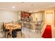 Open kitchen and dining area with breakfast bar and a red runner that welcomes you at 4061 Crockers Lake Blvd # 2618, Sarasota, FL 34238