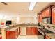 Well-equipped kitchen with granite countertops, stainless steel appliances, and eat-in bar at 4061 Crockers Lake Blvd # 2618, Sarasota, FL 34238