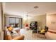 Bright living room with a sliding glass door to the screened lanai at 4061 Crockers Lake Blvd # 2618, Sarasota, FL 34238