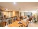 Open-concept living space with bar seating and access to a cozy balcony at 4061 Crockers Lake Blvd # 2618, Sarasota, FL 34238