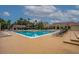 Beautiful pool area with abundant seating and lush landscaping at 4061 Crockers Lake Blvd # 2618, Sarasota, FL 34238