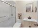 Updated bathroom featuring a sleek glass-enclosed shower, a modern vanity, and stylish fixtures at 4169 66Th Street W Cir # 4169, Bradenton, FL 34209