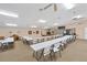 Bright meeting room featuring rows of tables, chairs, and ample lighting fixtures at 4169 66Th Street W Cir # 4169, Bradenton, FL 34209