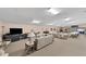 Large recreation room with comfortable seating, tables, and a TV area for various activities at 4169 66Th Street W Cir # 4169, Bradenton, FL 34209