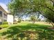 Spacious backyard with lush green lawn overlooking community golf course at 4355 Longmeadow # 23, Sarasota, FL 34235
