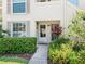 Charming condo entrance featuring a well-lit doorway and vibrant landscaping at 4355 Longmeadow # 23, Sarasota, FL 34235